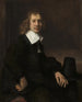 Młody mężczyzna siedzący przy stole, być może Govaert Flinck - Rembrandt van Rijn — widok dzieła