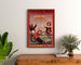 Plakat reklamowy vintage Grandes Galeries modernes, Agen, w ramie nad drewnianą komodą, między roślinami.