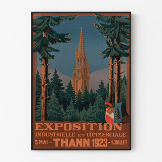 Plakat vintage Thann, wystawa przemysłowa, w cienkiej ramie na jasnej ścianie.