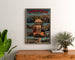 Plakat vintage Thonon-les-Bains, oprawiony nad drewnianą komodą, między roślinami.