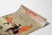 Plakat vintage Two Little Vagabonds, na zakrzywionej kartce, widok w perspektywie.